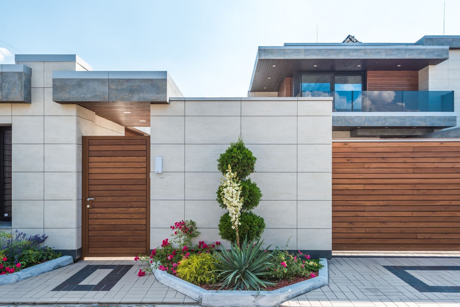 Contemporary home frontage with a landscaped garden and entry path